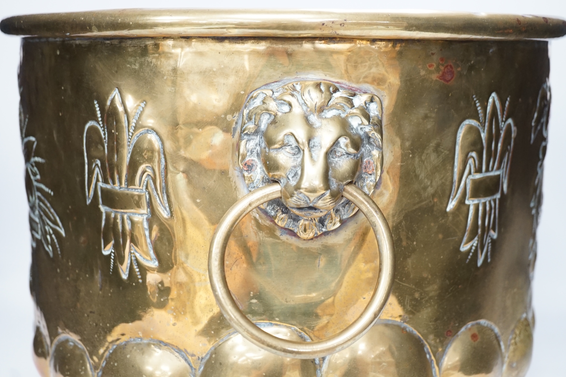 A 19th century Dutch embossed brass log basket, 33cm. Condition - poor, not original base